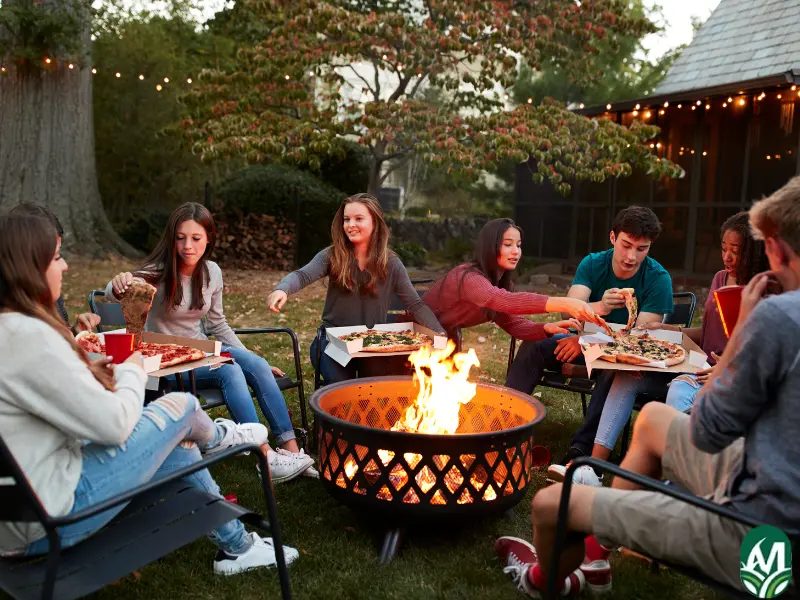 Friends and family have built their own fire pit to enjoy dinner around.