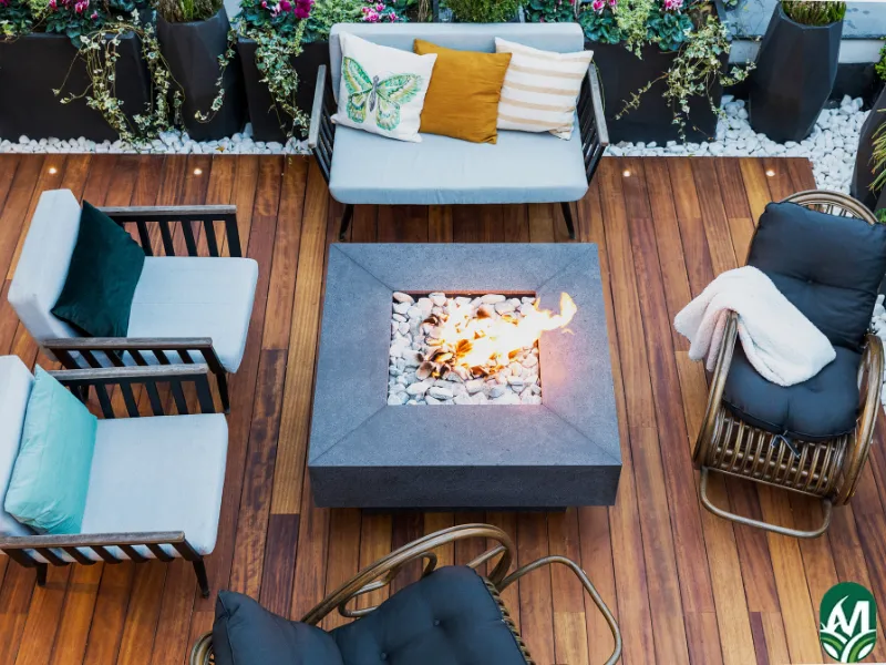 An aerial view of a ceramic fire pit with outdoor furniture (chairs) around it. This is for the Fire Pit Installation page.