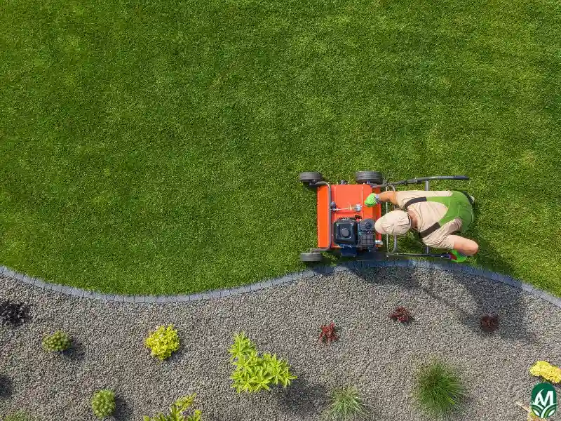 An overhead photo of a man mowing grass. This image is for the page Lawn Maintenance Services in Durham.