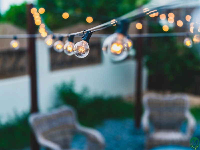 A close up of string lights on an outdoor patio by way of patio installation services in Durham, NC.