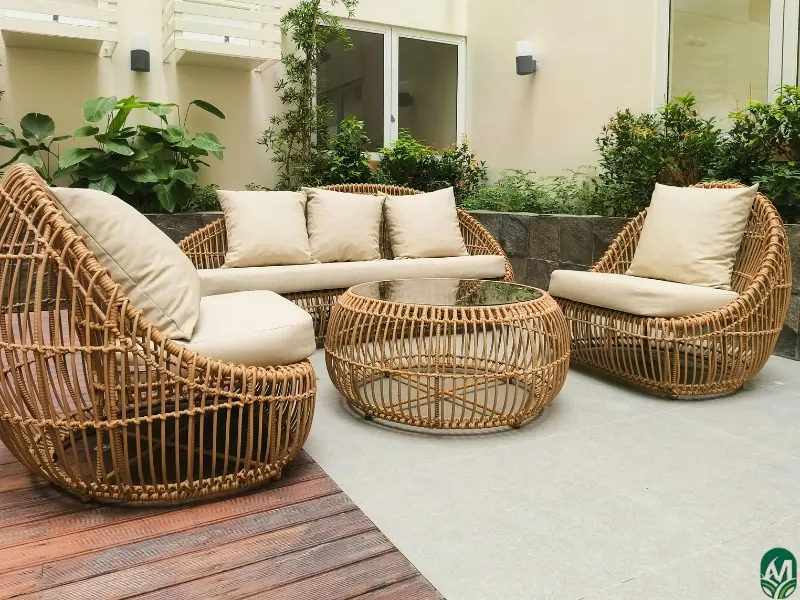 Bohemian outdoor furniture on a patio that was designed via patio installation services.